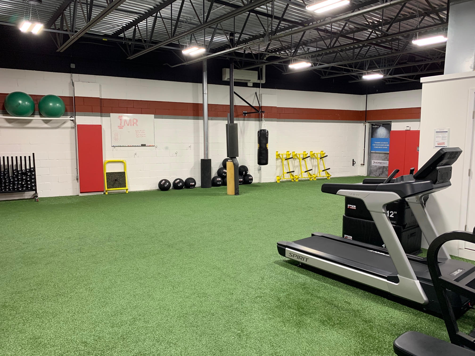 workout facility with turf and workout equipment