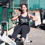 Vanessa Dooley team member working out on machine