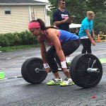 Vanessa Dooley team member lifting heave weights